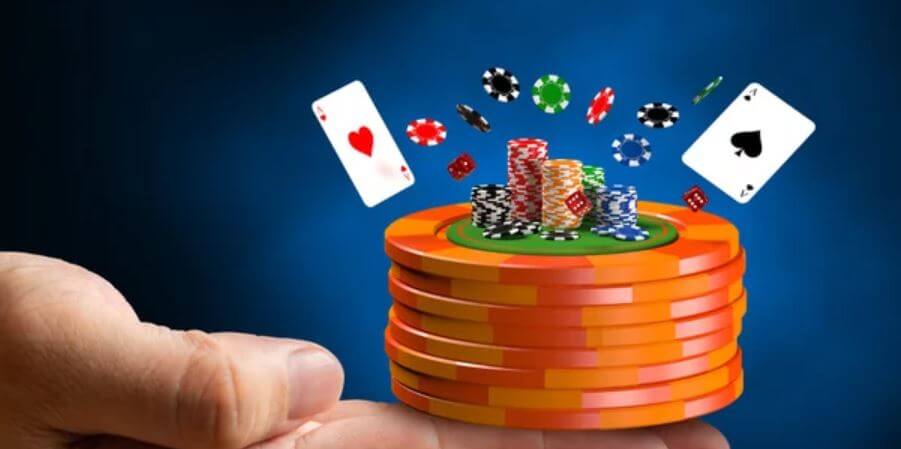 Hand holding casino markers cards -Super Andar Bahar