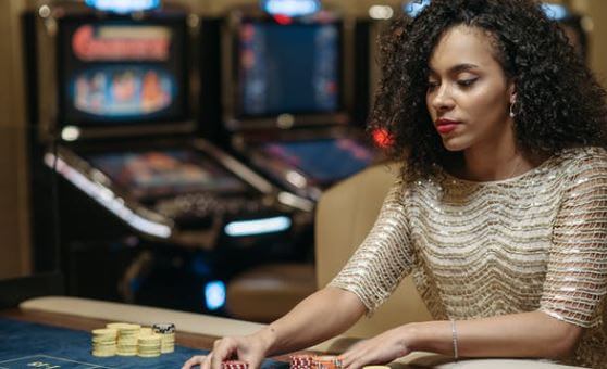Woman in dress playing Casino - Slot Joint Casino