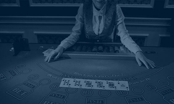 black and white blackjack table with live dealer