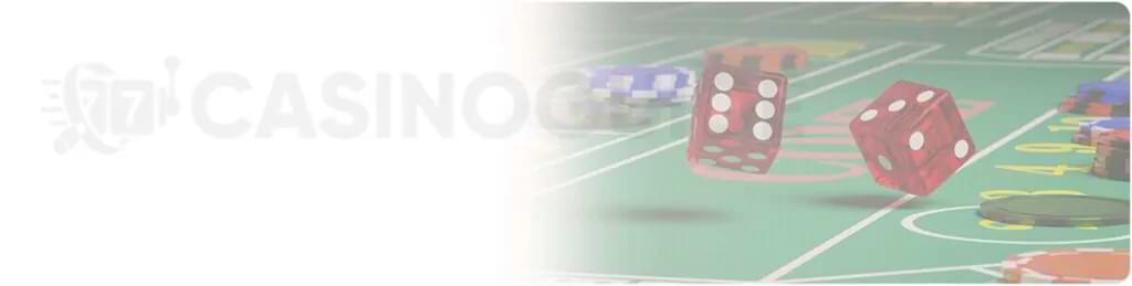 Craps bord, rode terninger, som er sloret af teksten CasinoGuide - DK